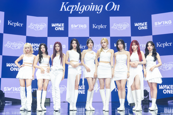 Girl group Kep1er poses for the camera during a press showcase held on Monday afternoon in eastern Seoul for their first Korean album ″Kep1going On″. [WAKEONE/SWING ENTERTAINMENT]